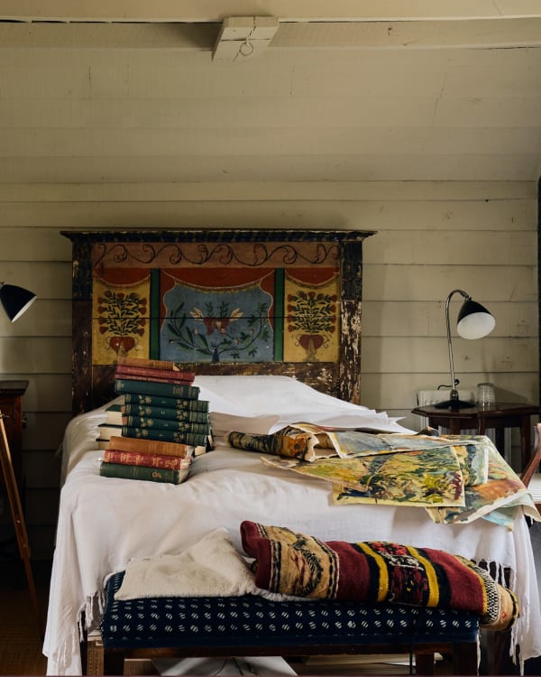 Past works pile up in the guest bedroom at her Wiltshire home.