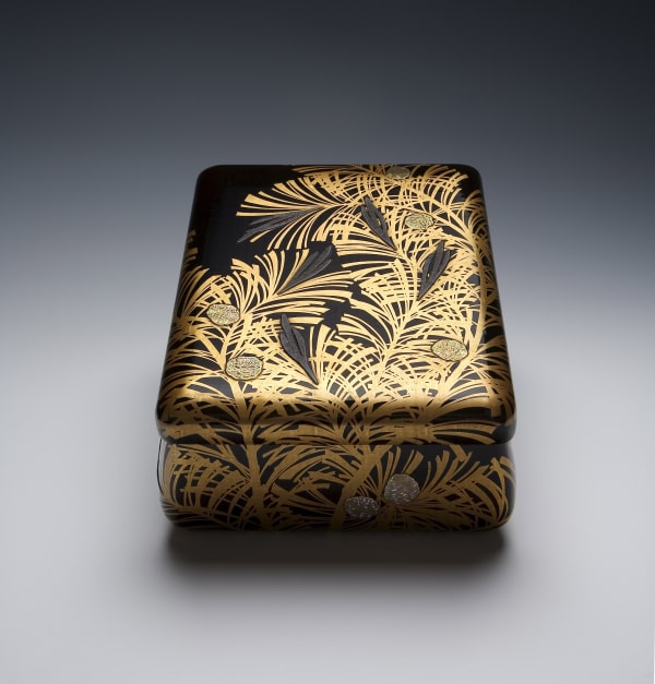 Gold Lacquer Box with Pine Cones. Maki-e gold lacquer with shell and pewter inlays on wood, 1929, Japan. Size 5 x 11 x 9 inches.