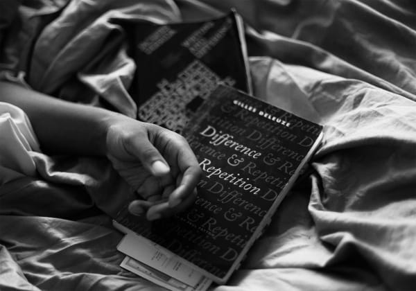 Caecilia Tripp, Sleeping with Books, (Gilles Deleuze), 2011 - ongoing Diasec, 120 x 170 cm, B&W Courtesy of the artist & Erna Hecey Gallery