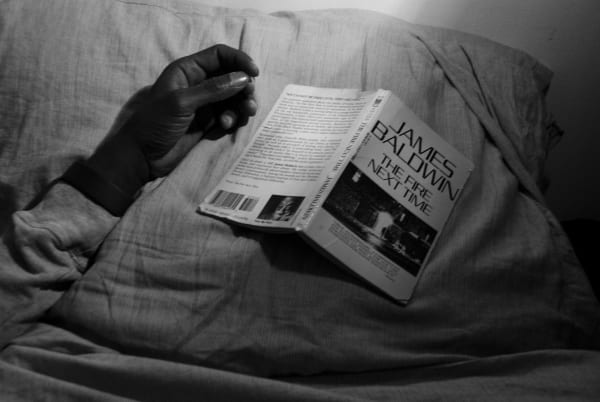 Caecilia Tripp, Sleeping with Books, (James Baldwin), 2011 - ongoing Diasec, 120 x 170 cm, B&W Courtesy of the artist & Erna Hecey Gallery