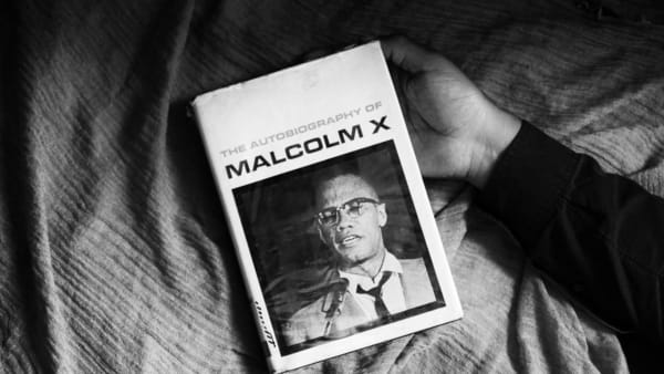 Caecilia Tripp, Sleeping with Books, (Malcolm X), 2011 - ongoing Diasec, 120 x 170 cm, B&W Courtesy of the artist & Erna Hecey Gallery