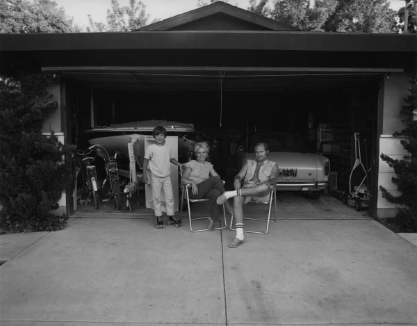 Bill Owens, Our house is built with the living room on the back, so in the evenings we sit out front of the garage and watch the traffic go by, from Suburbia series, 1972
