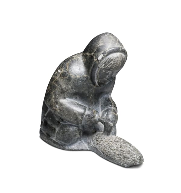 KALINGO, NUNAVIK (ARCTIC QUEBEC) Man Carving a Qulliq, late 1960s stone, 6 1/4 x 7 1/4 x 4 1/8 in (15.9 x 18.4 x 10.5 cm) ESTIMATE: $500 ⁠— $600 New Price: $400