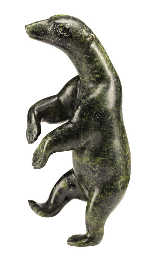 Lot 111 HENRY EVALUARDJUK (1923-2007), IQALUIT (FROBISHER BAY) Dancing Bear, mid 1970s stone, 9.75 x 4.5 x 2.5 in (24.8 x 11.4 x 6.3 cm) Estimate: $3,500— $5,000 price realized: $13,200