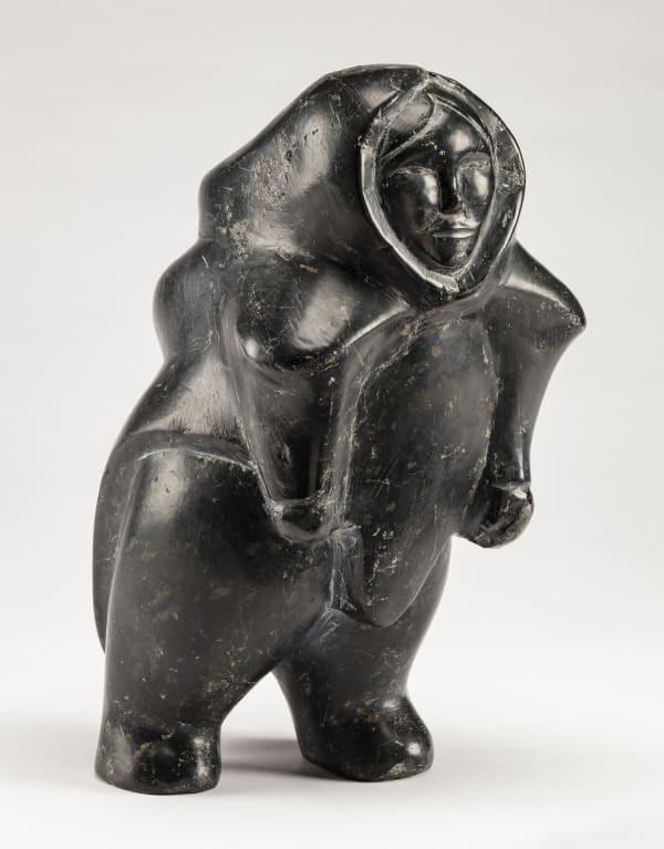 Lot 97 DOMINIC KINGILIK (1939-1990), QAMANI'TUAQ (BAKER LAKE) Walking Woman, 1964 stone, 10.5 x 6 x 6 in (26.7 x 15.2 x 15.2 cm) ESTIMATE: $3,500— $5,000 PRICE REALIZED: $3,360
