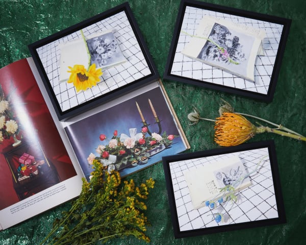 arrangement of flowers and paintings