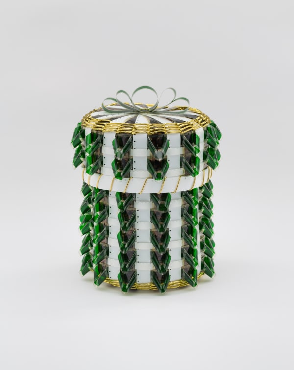 Gail Tremblay Will the Hunger to Make Money from Oil Melt the Sea Ice and Flood the Coastal Cities of the World?, 2018 16mm film (At the Winter Sea Ice Camp, 1967), translucent green and white 16mm film leader, white 8mm film leader, gold metallic braid 9 x 7 x 7 in