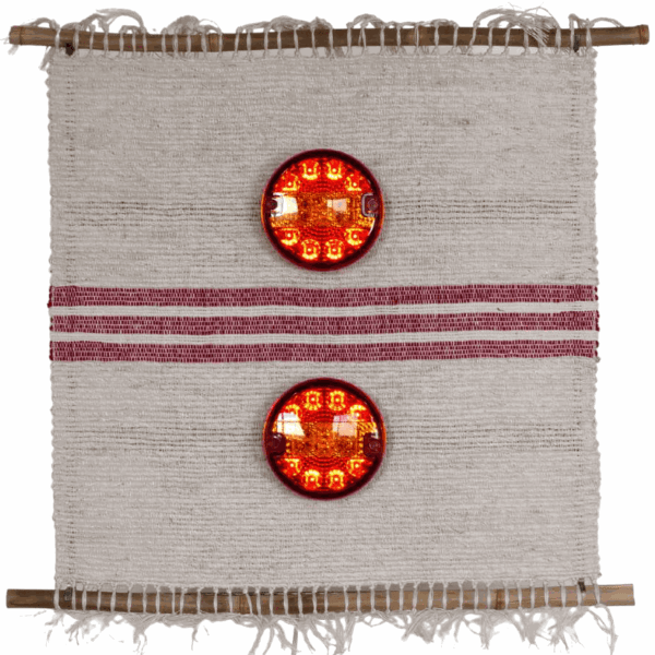 Wawita, 2022 Weaving with linen and wool, bamboos, truck headlights and steel structure 73 x 67 cm