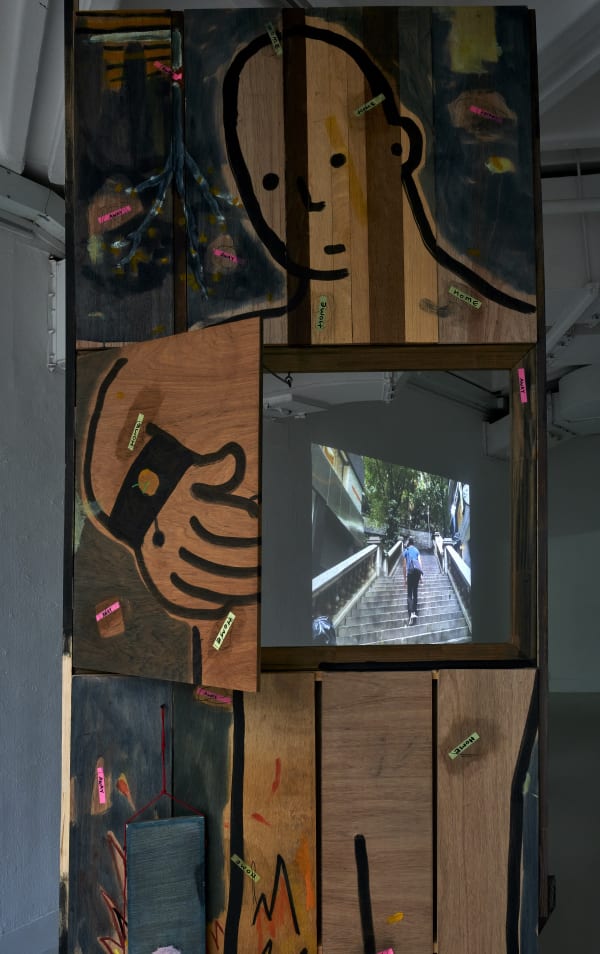 The Present is a Foreign Country (2022) Installation: Single-Channel Video, Acrylics & Charcoal Painting on Plywood, Dimension Variable