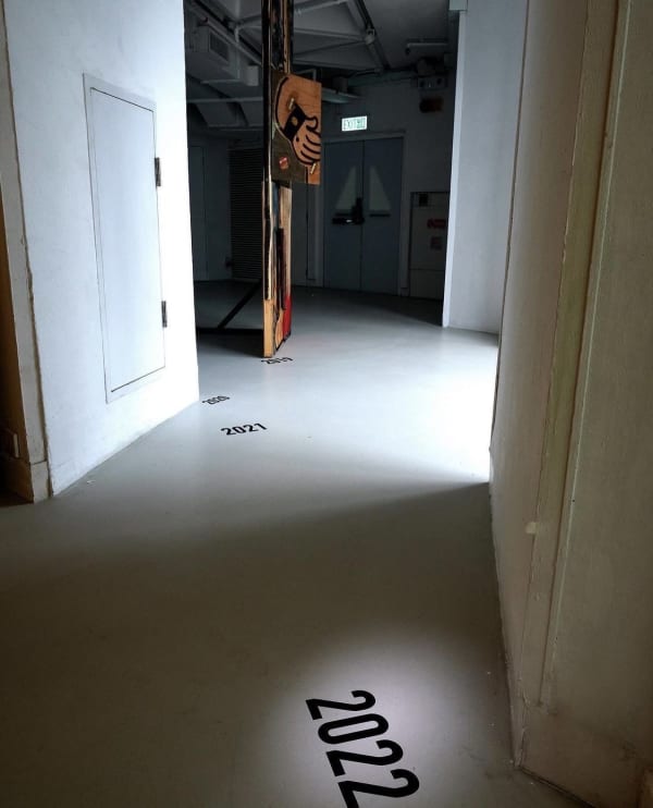 The Present is a Foreign Country (2022) Installation: Single-Channel Video, Acrylics & Charcoal Painting on Plywood, Dimension Variable