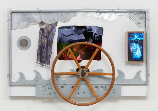 Weird Weirdness - Bizarre Bizarrerie , 2021-2022 2K digital film (22 min), TV, galvanized steel frame (hand cut), steering wheel, Ship of Fools’ flag, wooden box, neon and duratrans photographic film 172 x 253 x 27 cm