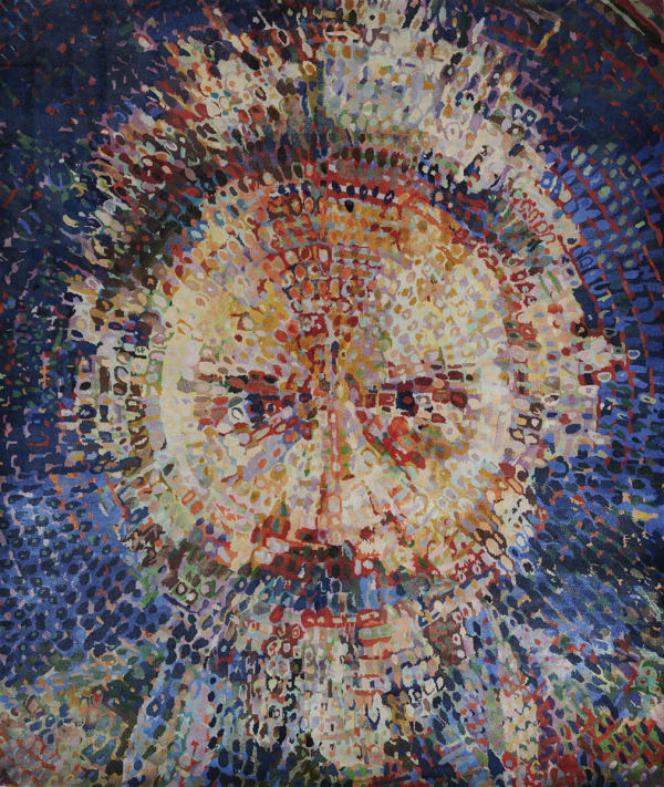 Bust-length frontal portrait of the artist Lucas Samaras, his face broken into spots of color in a circular target pattern centered between his eyes.