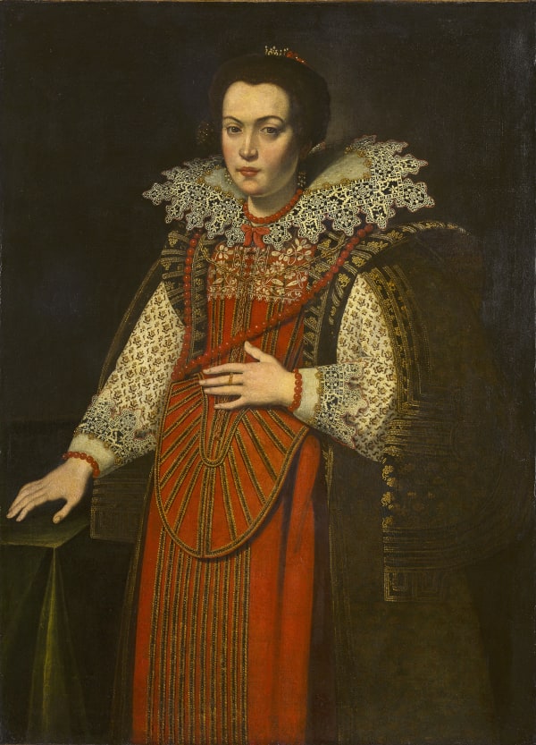 Three-quarter length portrait of a woman in a red dress with an intricate lace collar under an elaborately patterned brown and gold cape, her left hand resting against her abdomen.