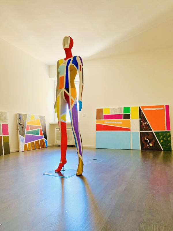 A sculpture "Streets of Woman", 2019 Gigi Rigamonti front of series of work "Streets of Life", 2019 by Gigi Rigamonti