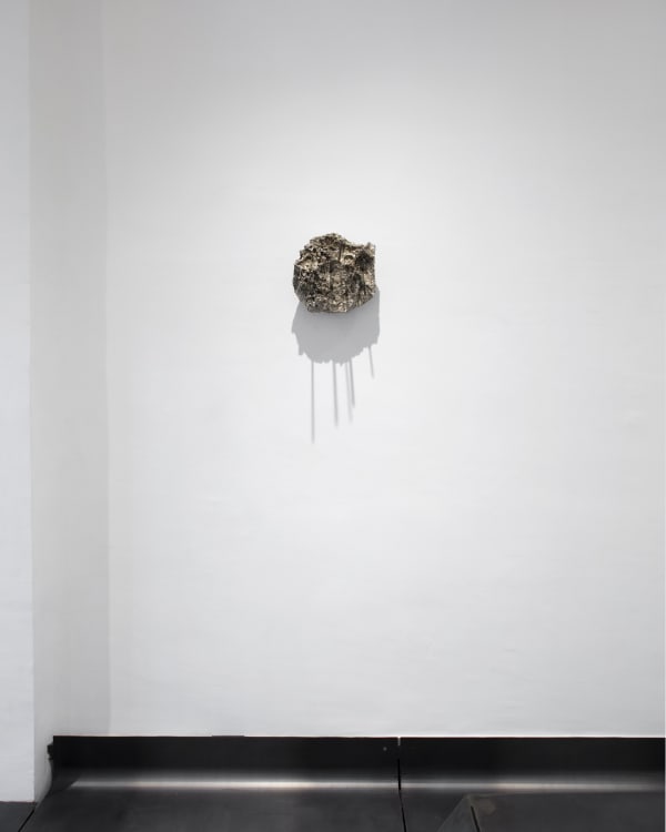 fig 33.7 the burning ground, 2022 blackened steel, nickel-plated volcanic rock 11 x 11.5 x 12.5 in 28 x 29 x 32.2 cm