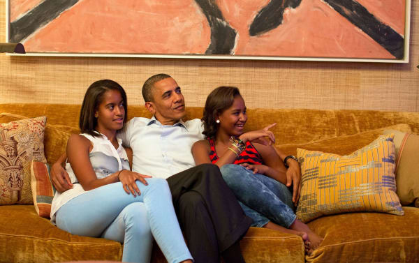 President Obama and his daughters, Malia (left) and Sasha, are seated in the Treaty Room under a painting by Susan Rothenberg.