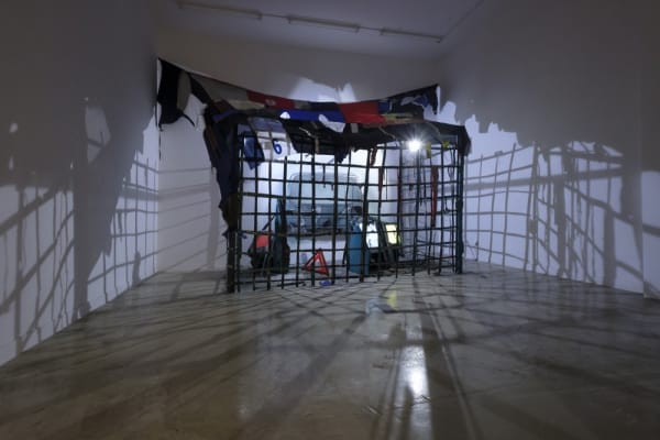 Marcin Dudek, Transhooligans, 2020, Steel, textiles, glass, plastic, steel dust, paint, 3 videos on monitor and dvd, halogen, wire, 557 x 370 x 200 cm, 219 1/4 x 145 5/8 x 78 3/4 in