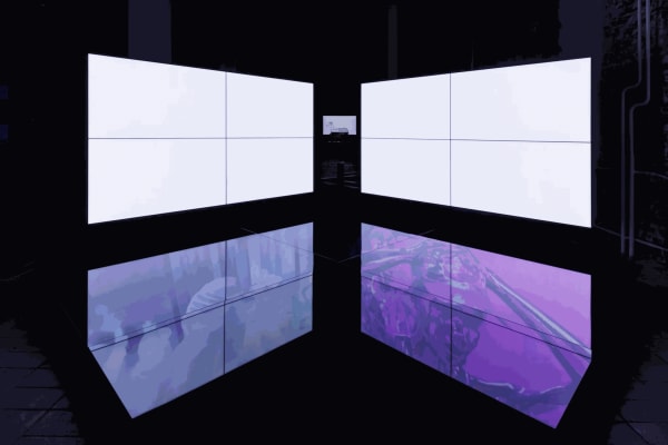 Emmanuel Van der Auwera, "VideoSculpture XXV (Archon)", 2022, eight LCD screens, black glass, cables, two-channel HD video (color, sound, 19 minutes). Installation view, KW Institute for Contemporary Art, Berlin, 2024. Photo: Frank Sperling.