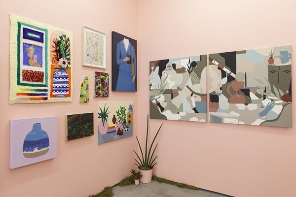 installation view of Lush 2022, gallery with peach walls and floral / plant themed artwork