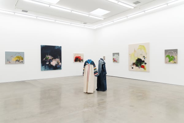 Seonna Hong installation view of solo exhibition Late Bloomer, two mannequins adorned with hanbok in center, large paintings in background on walls