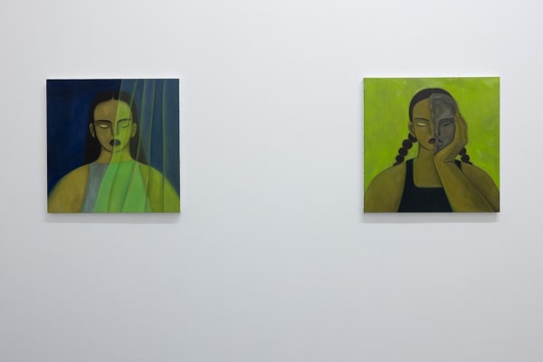 Installation photo of Hilda Palafox paintings of green women