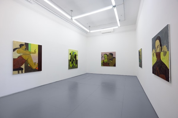 Installation photo of Hilda Palafox paintings of green women