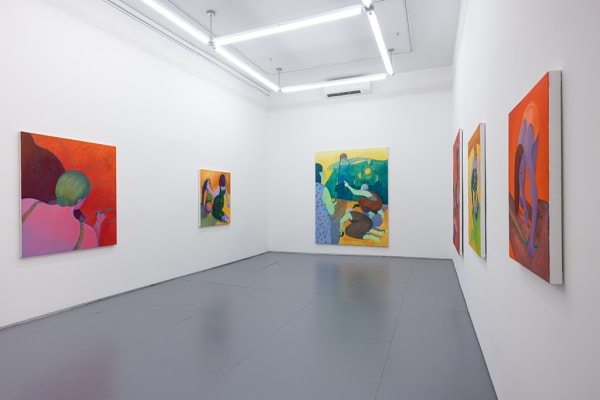 Installation image of red and yellow Genevieve Cohn paintings