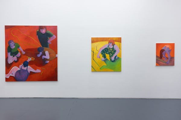 Installation image of red and yellow Genevieve Cohn paintings