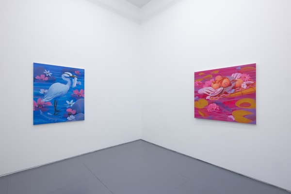 Installation image of two brightly colored paintings by Megan Ellen Macdonald
