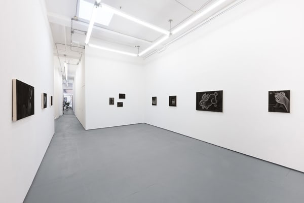 Installation view of Angela Fang Zirbes exhibition "House & Ghosts" featuring various grey scale paintings