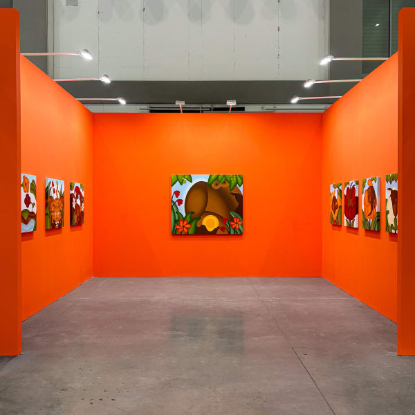 Orange walled gallery booth with tropical paintings by Bianca Nemelc