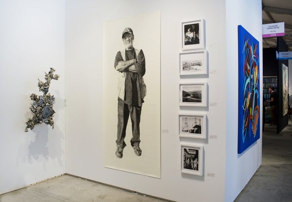 Peter Gronquist and Joel Daniel Phillips work at an art fair