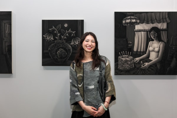 Angela Fang Zirbes in front of her artworks at Future Fair