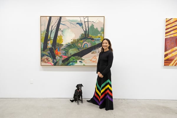 Meera and Artist Seonna Hong standing in front of her painting "Rest As an Act of Defiance" at The Jaunt: Winter Camp opening reception at Hashimoto Contemporary San Francisco