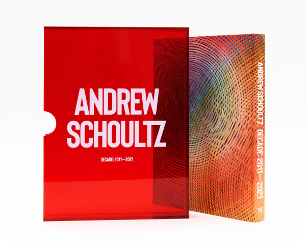 Cover of "Decade: 2011 - 2021" Collectors Edition by Andrew Schoultz. Featuring clear red book sleeve.