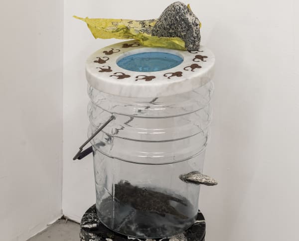 Catherine Telford Keogh Dust Gardens (&&& Arrested Cavity), 2025 Mold-blown glass (Leaktite™ 2-gallon white plastic pail), waterjet-cut Carrara marble, waterjet-cut terracotta porcelain, found diorite, steel rod, sandblasted glass tube, inherited Starling skin, stained glass, found landfilled tablecloth, table cloth dust after wiping, black ink tracing 16⅜ x 10¼ x 12¼ inches 41.7 x 26 x 31.1 cm