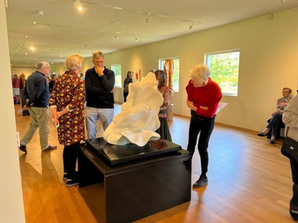 The marble sculpture ‘Exodus: Intimacy and Isolation’ is admired