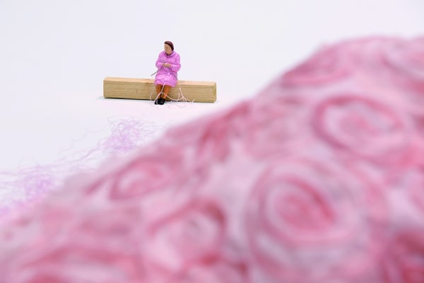 Lilaana Porter, "Tejedora (Knitter)," 2017, detail view; fabric and figurine on wooden base with pink string, dimensions variable. Image courtesy of SCAD Museum of Art, Savannah, and El Museo del Barrio, New York