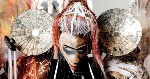 Rina Banerjee, "Viola, from New Orleans-ah, an African Woman, was the 19th century’s rescue worker, a global business goods raker, combed, tilled the land of Commerce, giving America a certain extra extra excess culture, to cultivate it, making home for aliens not registered, made business the finer, finer, had occupations, darning thread not leisure with reason and with luster, in “peek a boo” racial disguises preoccupied in circulating commerce, entertaining white folks, pulling and punching holes in barriers, place that where was once barren, without them, white banks made of mustard and made friendly folks feel home, welcomed and married immigrants from far noted how they been also starved, fled from servitude and colonial dangers, ships like dungeons, posing coal in termite wholes, churning fire, but always learning, folding, washing, welcomed as aliens. She wandering, hosting, raising children, connected to new mobilities and most unusual these movements in Treme’, New Orleans was a incubating, enmeshed embedded in this silken cocoon when she land, she’s came to be parachute mender, landed those black immigrant peddlers from Hoogali network of new comers," 2017, Murano glass horns, Indian rakes, seed beads, steel, Yoruba African mask, oyster shells, cowrie shells, Charlotte dolls, polyester horse hair trim, Korean silks, Indian silks, vintage Kashmir shawls, French wire ferris wheel, Congolese elbow bangles, colonial mirror sconces, Japanese seed glass beads, sequins, threads, dimensions variable