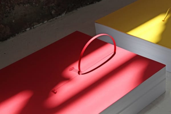 Marco Maggi, "Underline," 2014, detail view; 60 8.5 x 11 inch reams of paper; cuts and folds on 8 1/2 x 11 inch sheets of yellow, blue, and red Wassau card stock