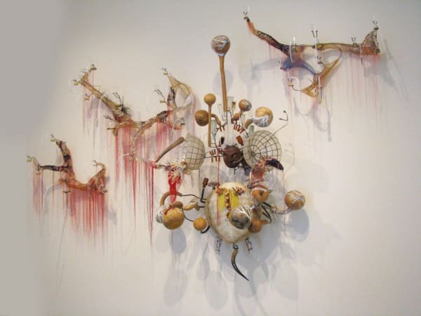 Rina Banerjee, When signs of origin fade, fall out, if washed away, trickle into separations, precipitate when boiled or filtered to reveal all doubleness as wickedness. Vanishing act that migration, mixation like mothers who hid paternity who could name move me slowly reveal me only when my maker stands straight, 2017, Turtle replica in resin, vintage shell lampshades, steel armature, Polynesian wood mask, Pyrex filtration lab glassware, feathers, linen thread, silk, amber vials, cowrie shells, seed beads, pearls