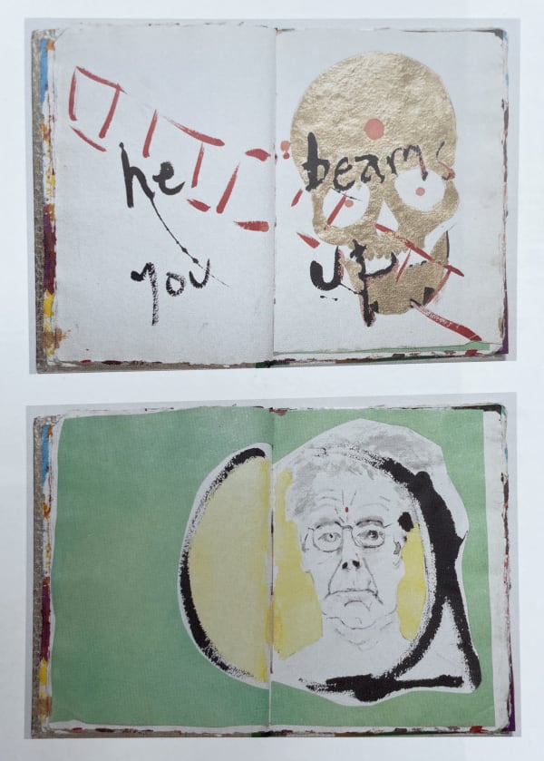 Inside pages of book, one with golden skull and one with self portrait of Max Gimblett