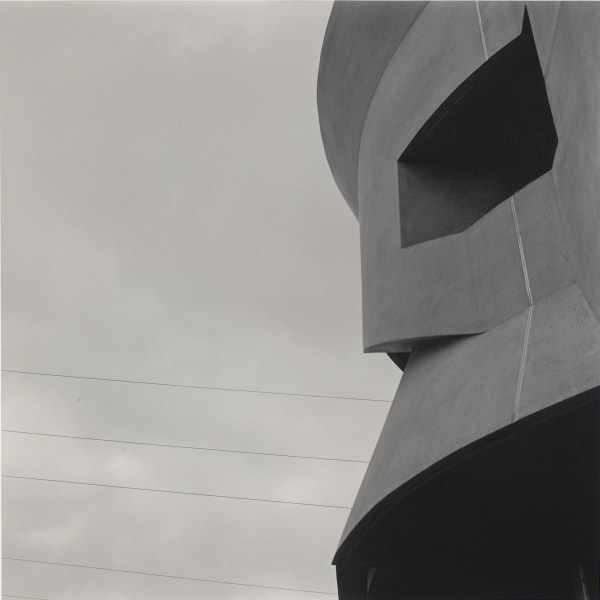 architectural detail of eclectic, stacked columns against sky