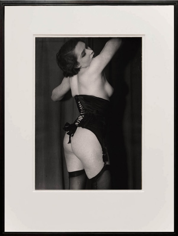 framed photograph of woman in black corset, by Brassai