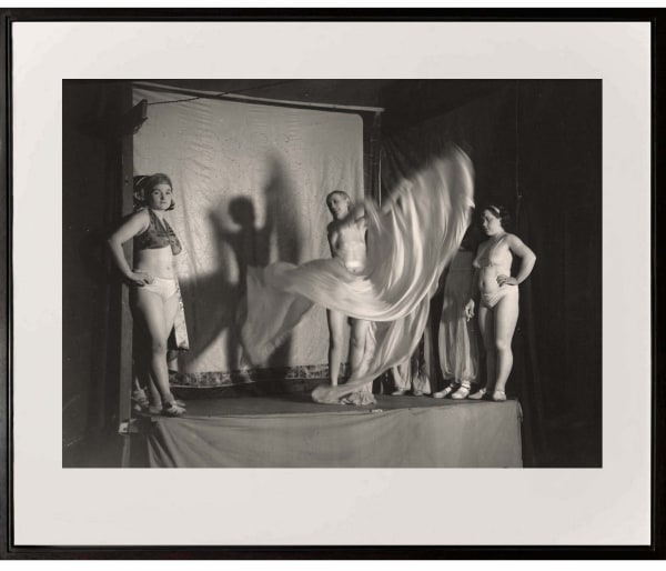 group of women on stage at the Fete Foraine from Paris de Nuit by Brassai