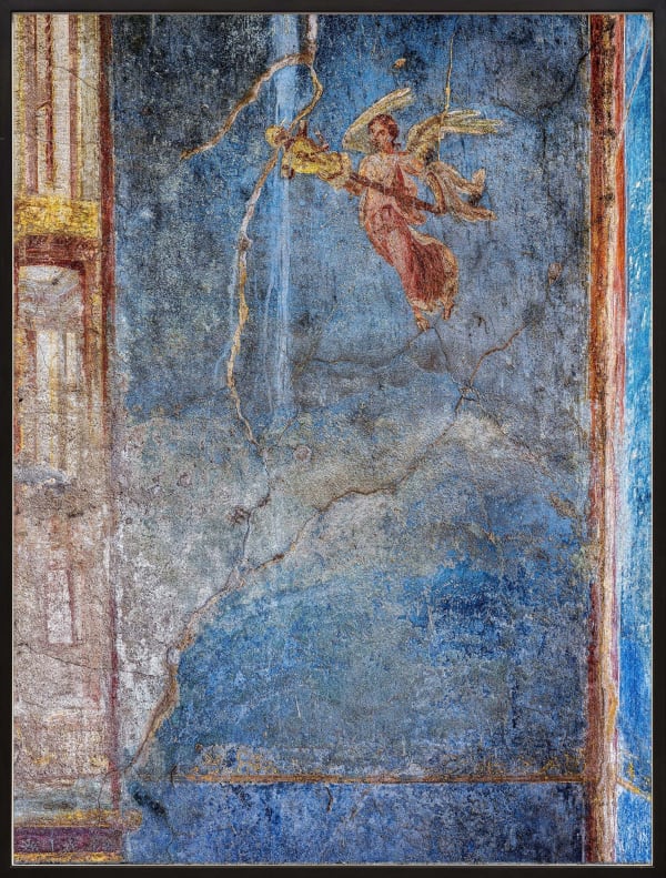 Painted fresco from Pompeii, Italy with blue wall and angel figure by Robert Polidori
