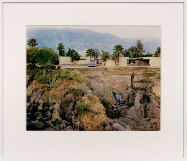 Joel Sternfeld, car in ravine below houses and hills