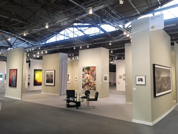 Edwynn Houk Gallery's booth at AIPAD showcasing work by Sally Mann, Valerie Belin, and Vik Muniz