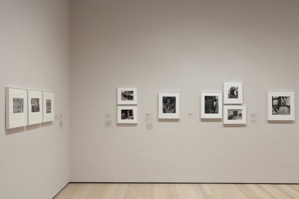 installation of photographs in white frames in MoMA