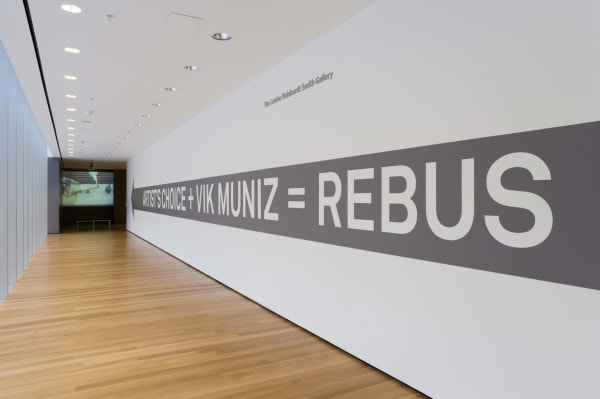 Installation view of the exhibition "Artist's Choice: Vik Muniz, Rebus" at the Museum of Modern Art